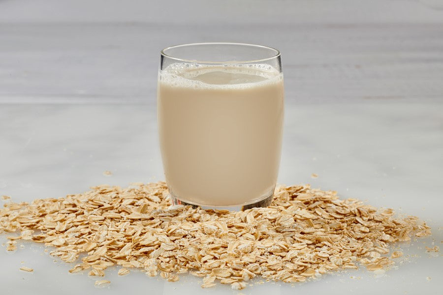 Organic Oats And Glass Of Better Than Milk Unsweetened Oat Drink