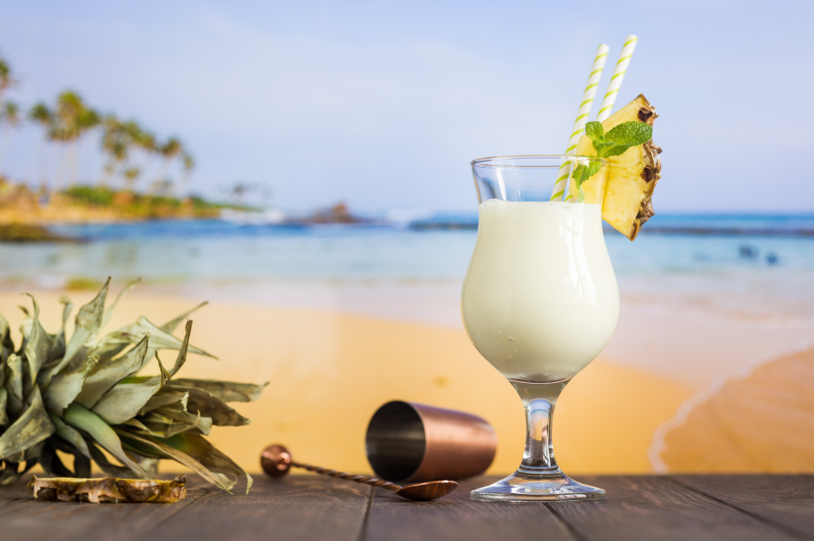 Coconut Water Tropical Pineapple Pina Colada Coconut Drink With Bar Tools And Beach Background