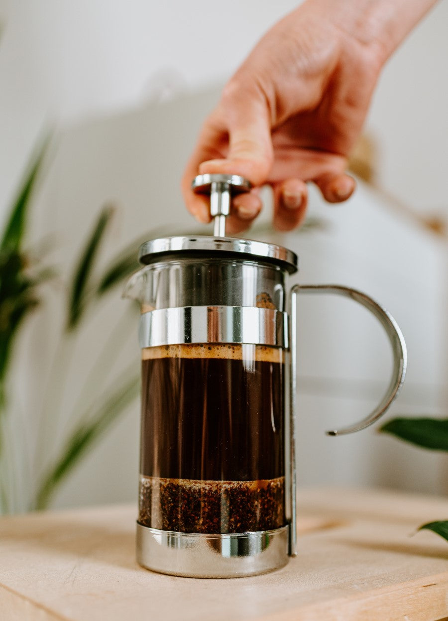 Pressing Down The French Press Coffee