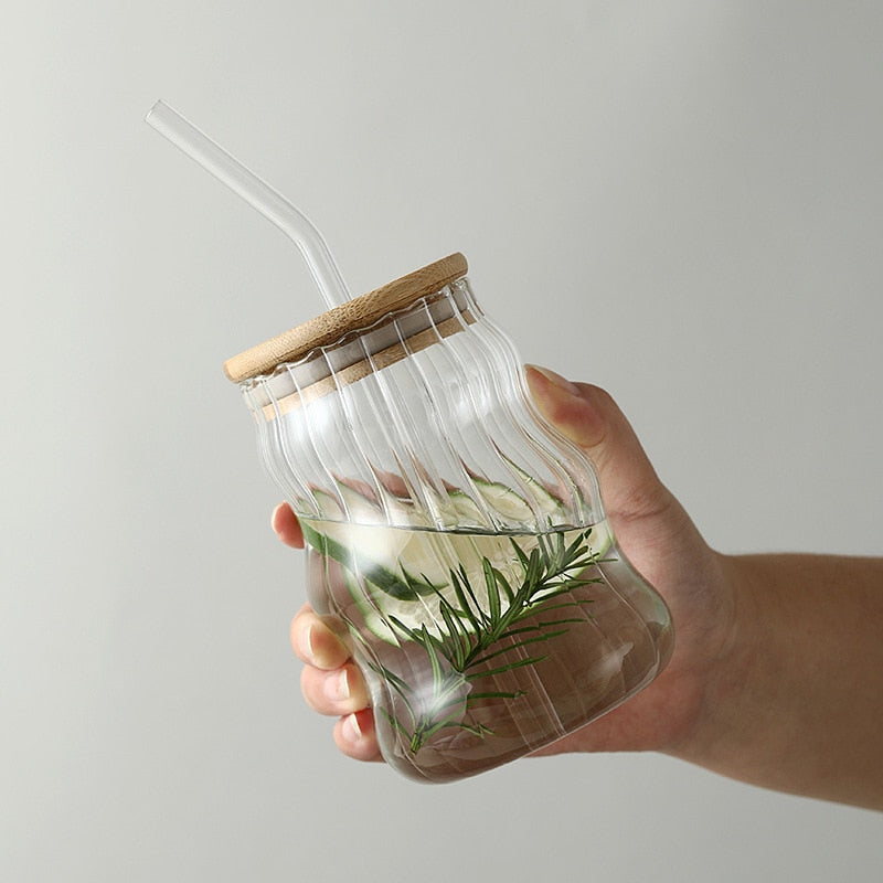 Holding A Drink In Glass Tumbler With Bamboo Wood Lid