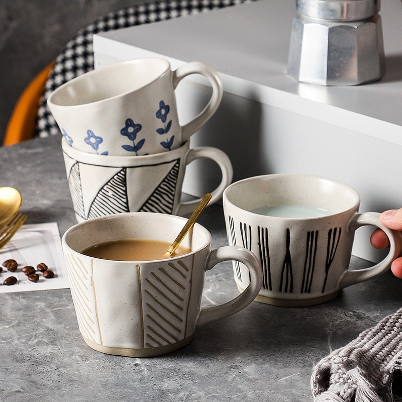 Blue Flowers Black Diagonal Beige Hatch And Black Twine Patterns On 4 Craft Style Purposefully Irregular Shape Ceramic Mugs Coffee Cups With Exposed Bases