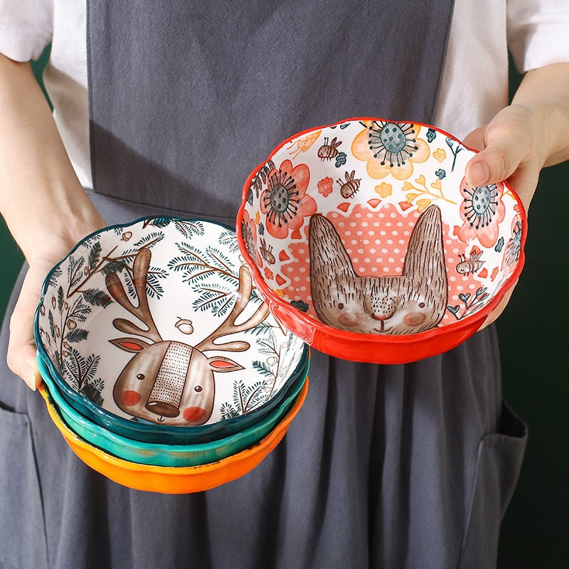 Holding Colorful Stackable Ceramic Pottery Bowls In Adorable Woodland Animal Prints