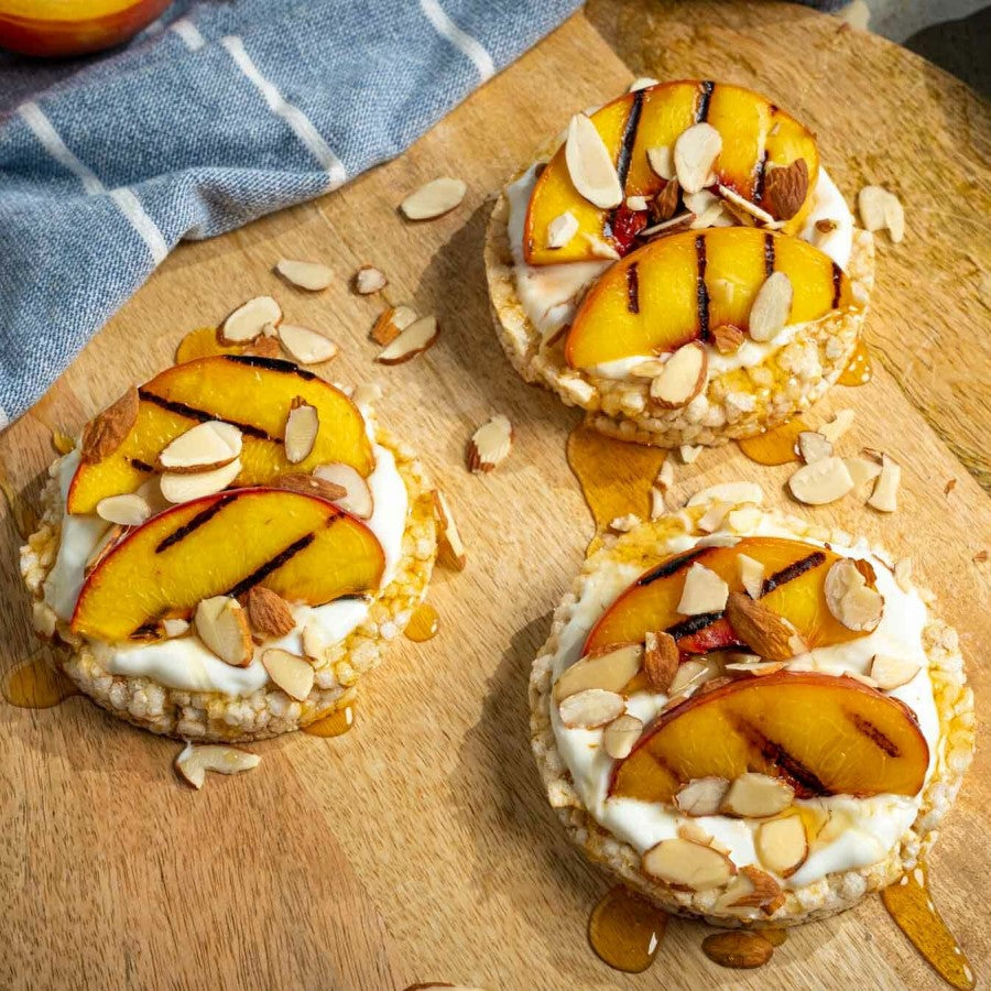 Salted Caramel Rice Cakes With Grilled Peaches And Sliced Almonds Healthy Dessert Treat Using Lundberg Family Farms Organic Rice Cakes