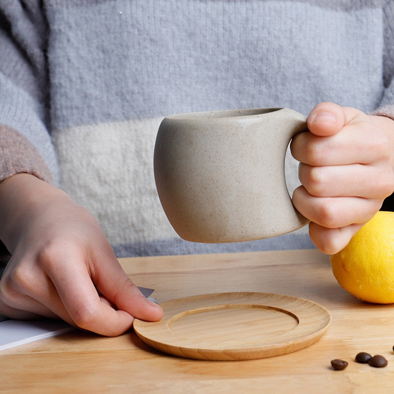 Holding Beautiful Mug And Wood Coaster Organic Style Ceramic Cup