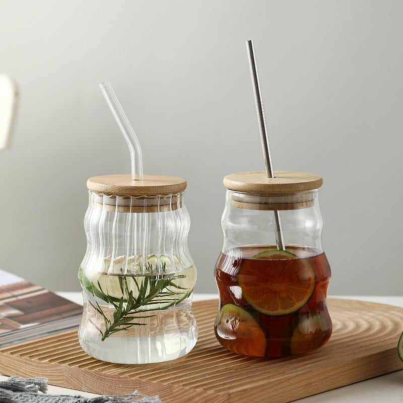 Refreshing Drinks In Organic Looking Style Drink Tumblers Wavy And Ripply Glass Design Styles With Bamboo Wood Lids