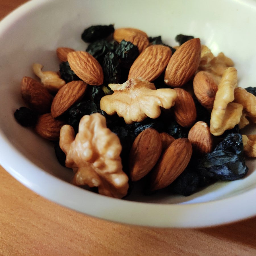 Bowl Of Healthy Nuts And Raisins For Organic Snacking