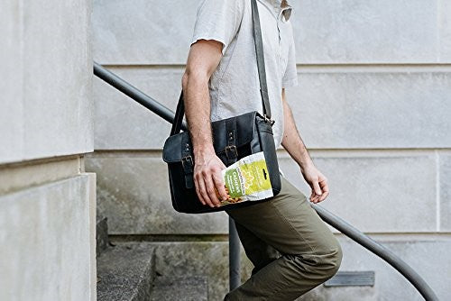 Man Walking Down Steps Leaving Work With A Bag Of Sunshine Nut Company Roasted Herb Cashews For A Healthy Snack