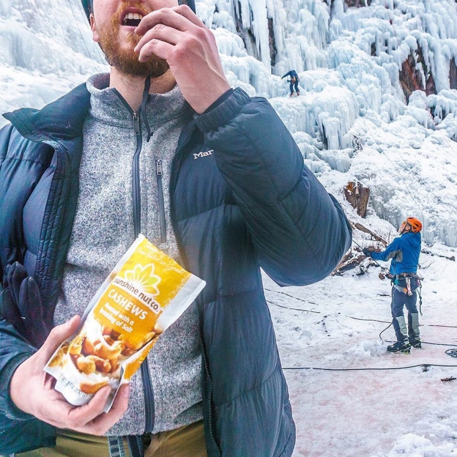 Winter Rock Climbers Outdoors Snacking On Cashews Roasted With A Sprinkling Of Salt From Sunshine Nut Co.