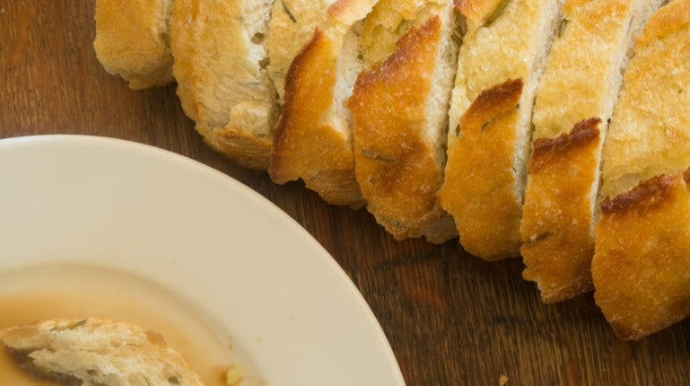 Organic Herb Bread Rosemary Loaf From The Essential Baking Company Served With Hot Soup