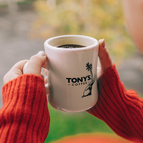 Holding A Mug Of Tony's Coffee Dark Roast Espresso Noir