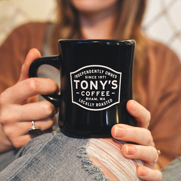 Black Mug Of Organic Tony's Coffee Locally Roasted In Washington In Small Batches