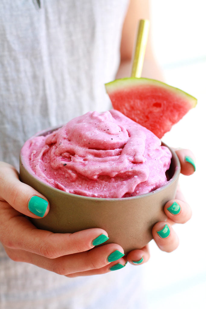 Woman's Hands Holding Smoothie Bowl Of Watermelon Dragon Fruit Sorbet Made With Madhava Light Agave Syrup