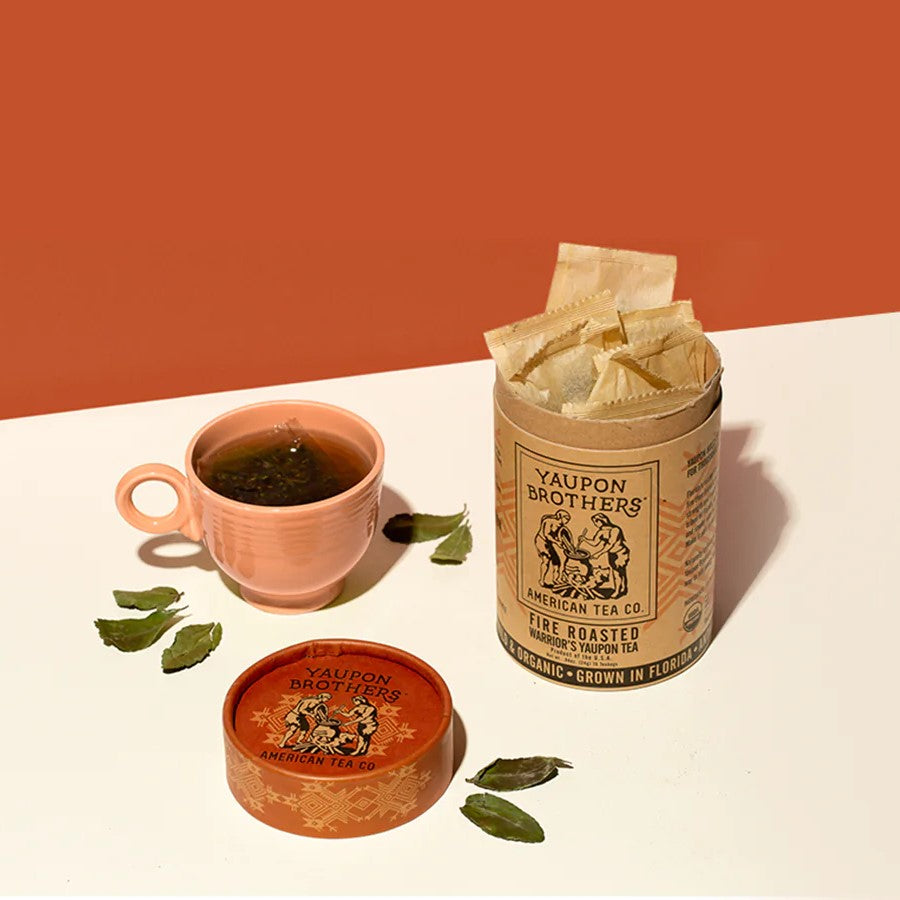 Eco Friendly Canister Of Organic Tea Yaupon Brothers Fire Roasted Warrior's Holly Tea Leaves And Cup Of Tea