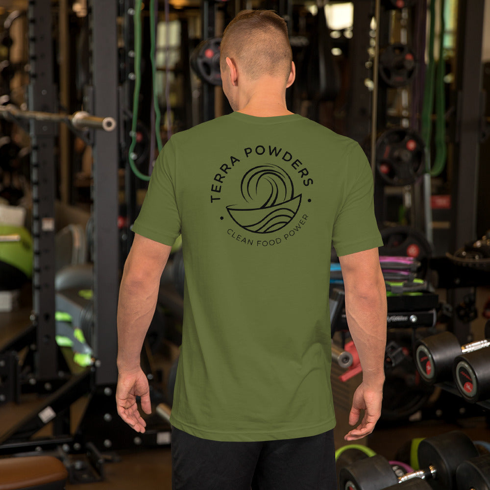 Man In Gym Working Out In Terra Powders Clean Food Powered Olive Short Sleeve Shirt With Terra Powders Logo On Back